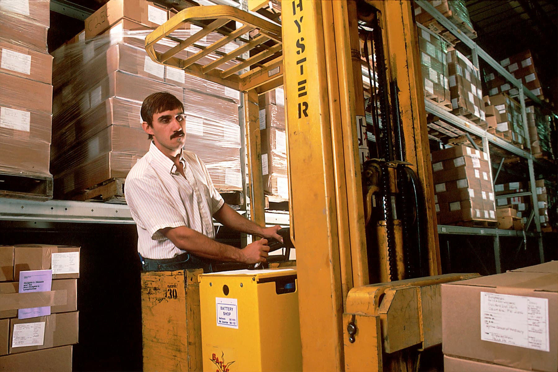 Forklift being inspected in a warehouse environment