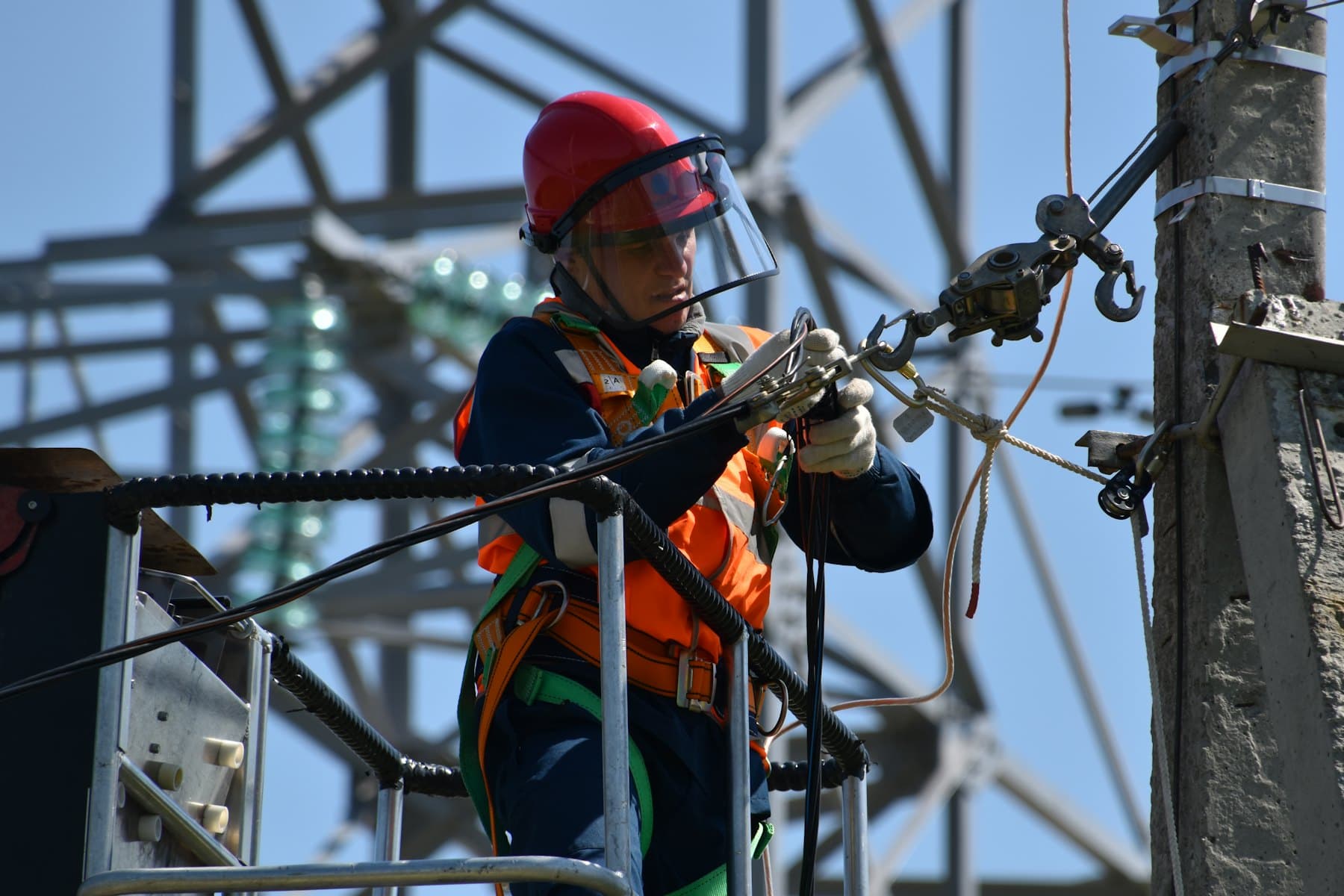 Technician working at height on a telecom tower